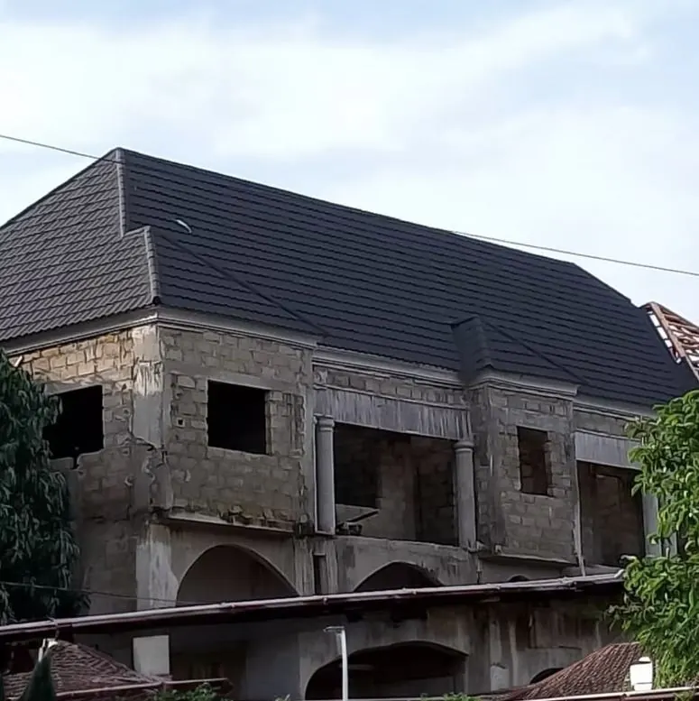 Two-storey house in The Gambia with roofing complete